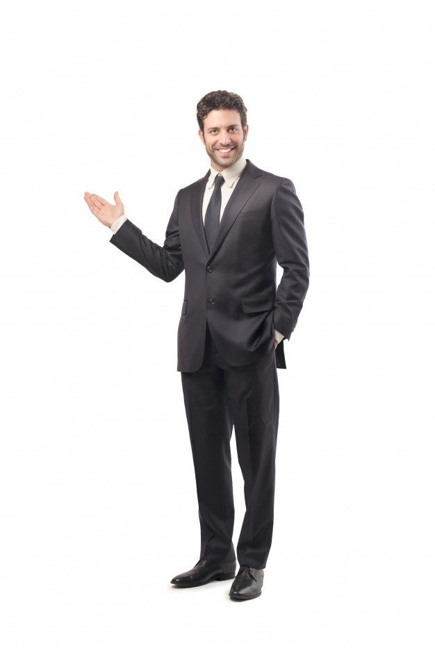 a man in a suit and tie standing with his hands out