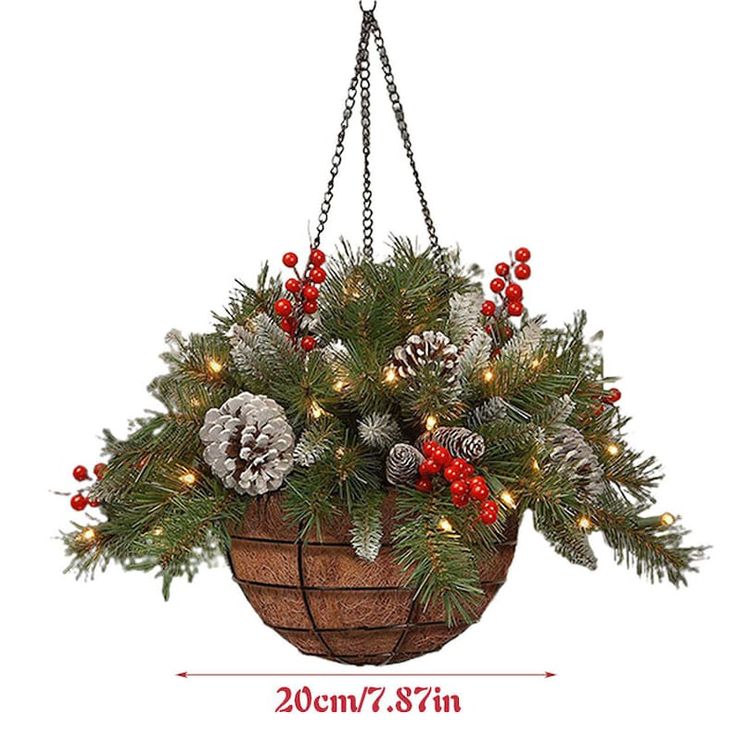 a hanging basket filled with pine cones and red berries is adorned with christmas lights on the branches