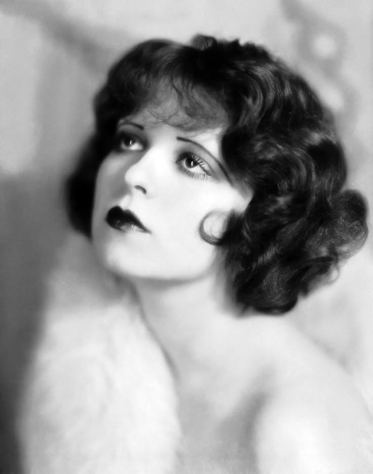 Clara Bow, the original "It Girl" was a famous 1920s silent film era star.  She was known for her red curls. Check out the bangs. 1920's Hairstyles, 1920's Makeup, Clare Bowen, Lady Mary Crawley, 1920s Makeup, 1920s Hair, Clara Bow, Silent Film Stars, Louise Brooks