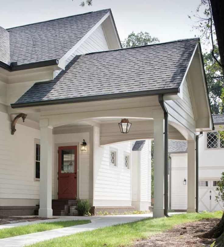 a white house with a red front door