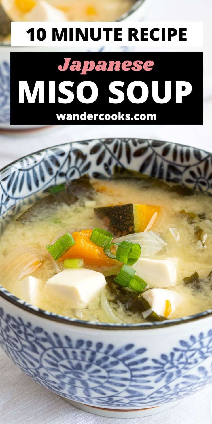 japanese miso soup with tofu and carrots in a blue and white bowl