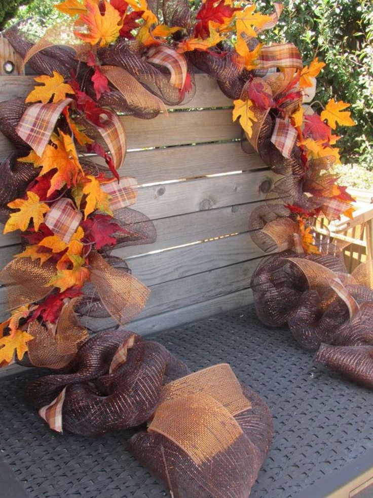 fall wreaths and burlocks on the back of a pickup truck