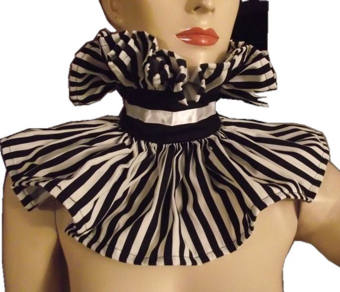 a female mannequin wearing a black and white striped dress with ruffles