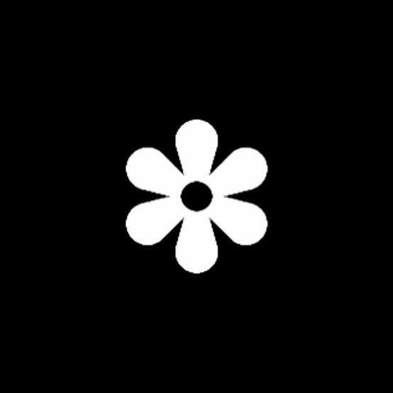 a white flower on a black background with the word's logo in the center