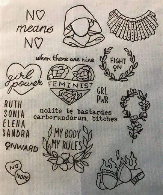 some tattoos on a piece of paper with words written in the middle and small hearts