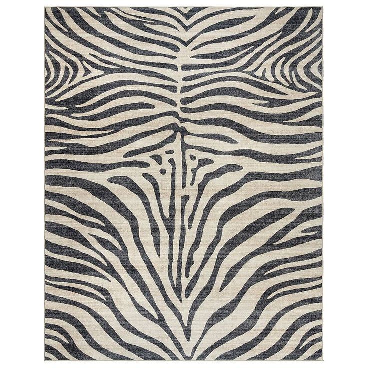 a zebra print rug with black and white stripes