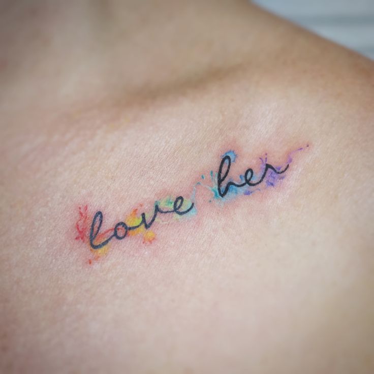 a woman's chest with the words love her written on it