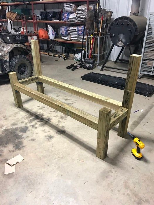 a bench made out of wood in a garage