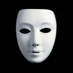 a white mask on a black background