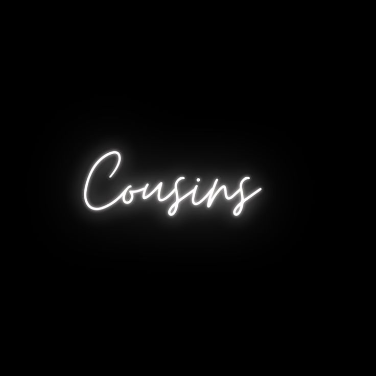 the word cosys is lit up in the dark with white letters on it