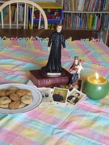 a table topped with cookies and figurines on top of a bed