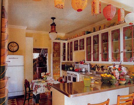 a kitchen filled with lots of counter top space next to a white refrigerator freezer