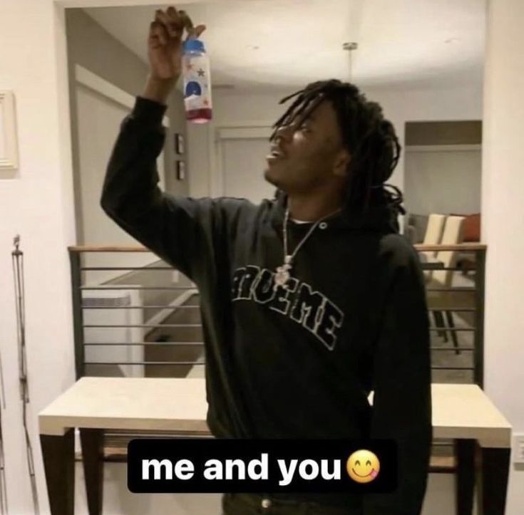 a man with dreadlocks holding up a water bottle in his hand and the caption me and you