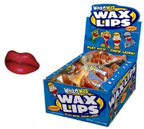 a box of wax lips next to a red lip