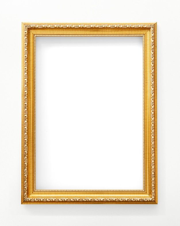 an empty gold frame hanging on the wall in front of a white wall and floor