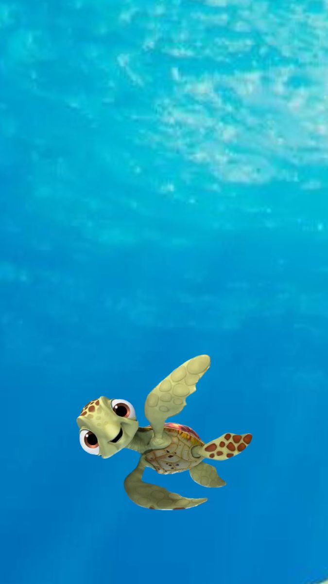 a turtle swimming in the water with its eyes open