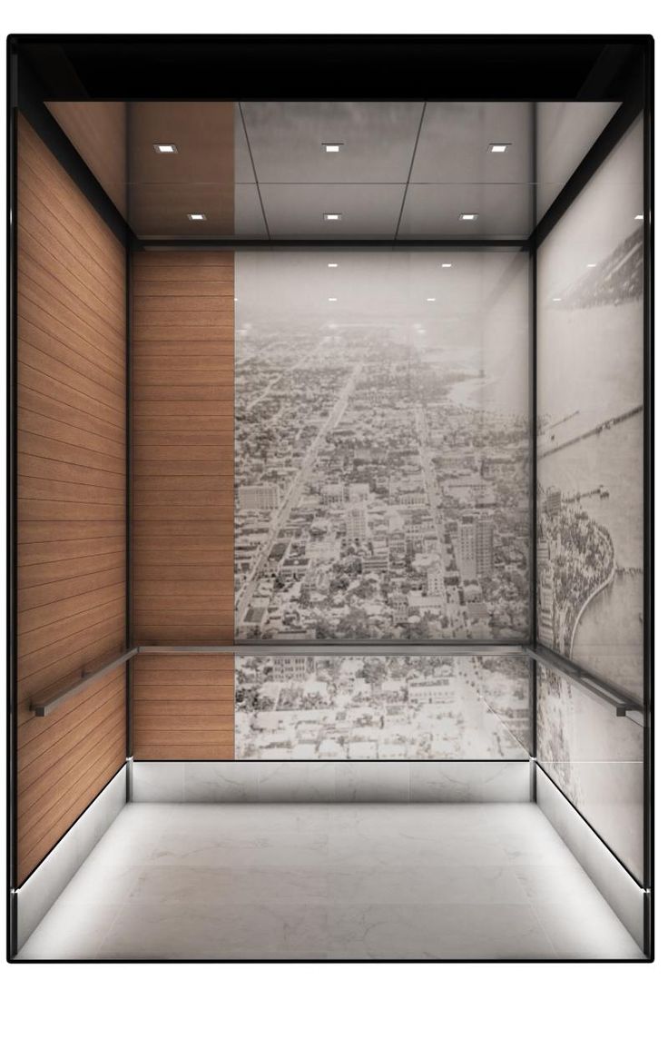 an empty room with wood paneling and glass walls, looking down at the city