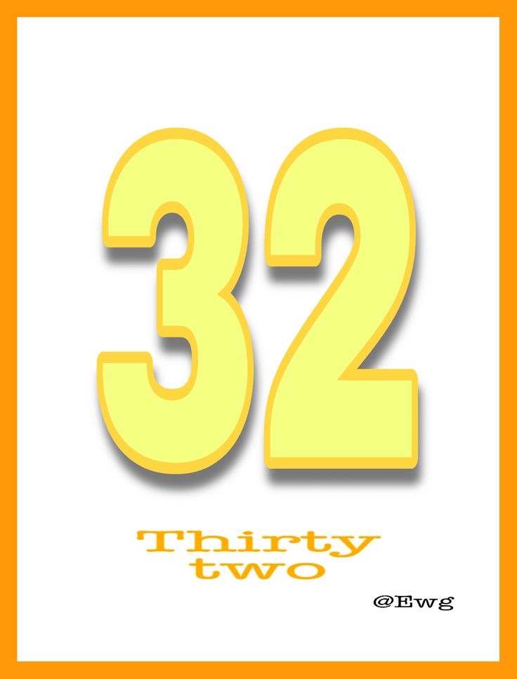 the number twenty two is yellow and has white lettering that reads 32 thirty two on it