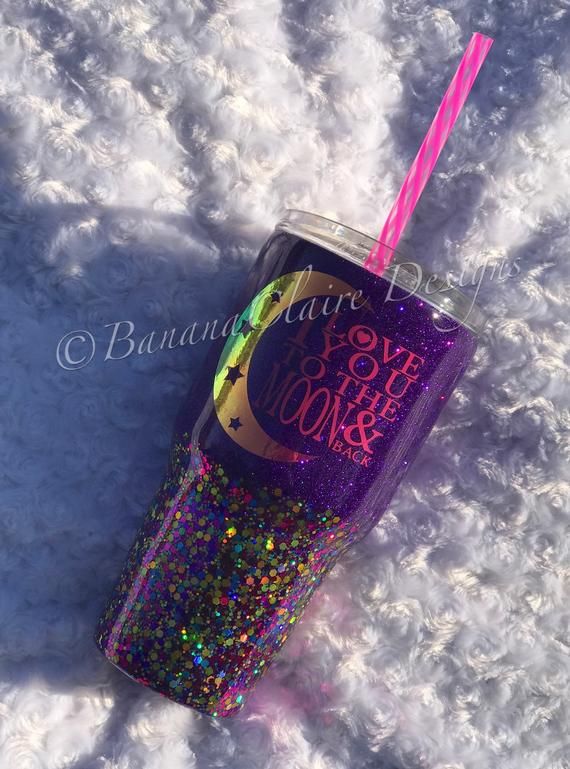 a purple glitter tumbler with a pink straw sticking out of it's side