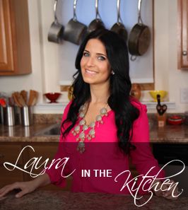 a woman standing in a kitchen next to pots and pans