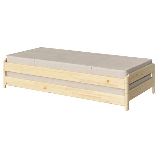 the bed frame is made out of wood and has two mattresses on each side