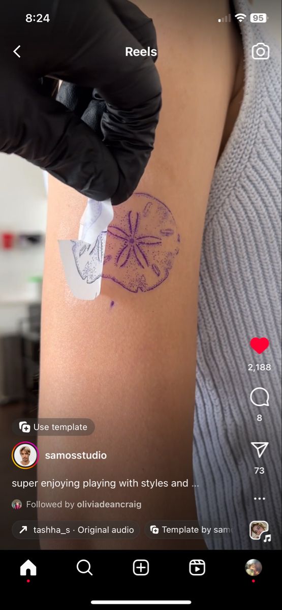 someone is doing something on the back of their arm that has an image of a starfish