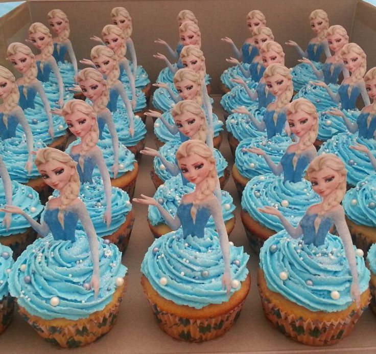 there are cupcakes with frosting that look like frozen princesses