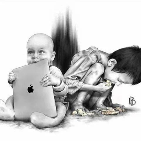 two babies playing with an apple computer