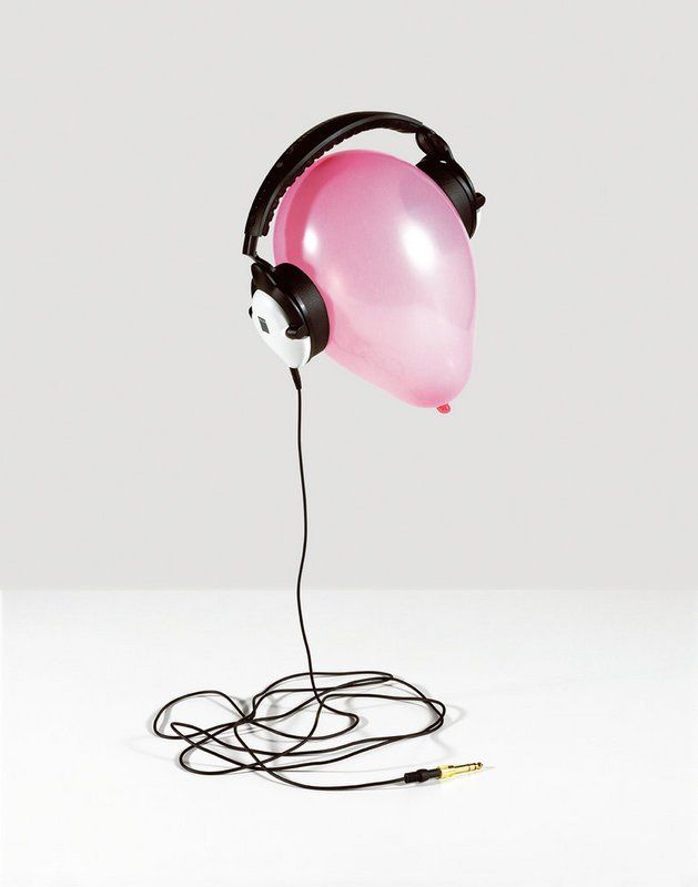 a pink balloon with headphones attached to it