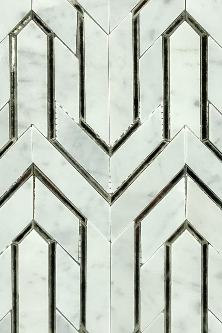 an image of marble tiles that look like hexagons or chevrons