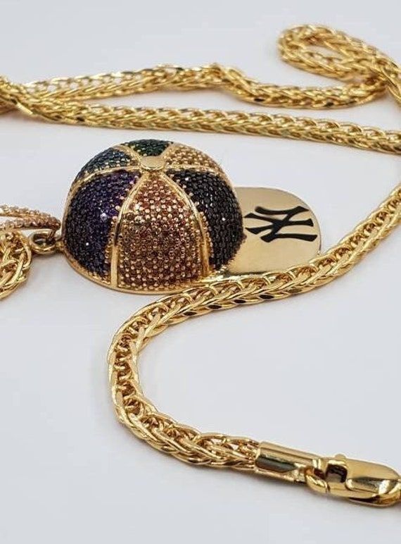 a gold chain with a basketball on it