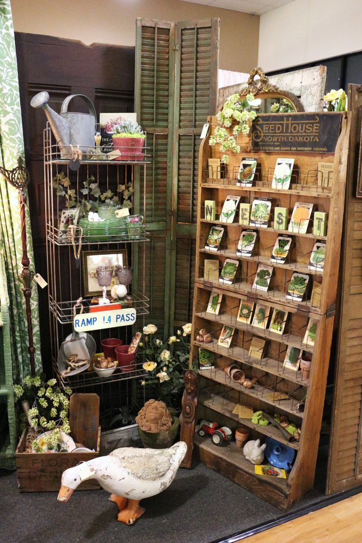 there is a display in the store with lots of things on shelves and birds figurines