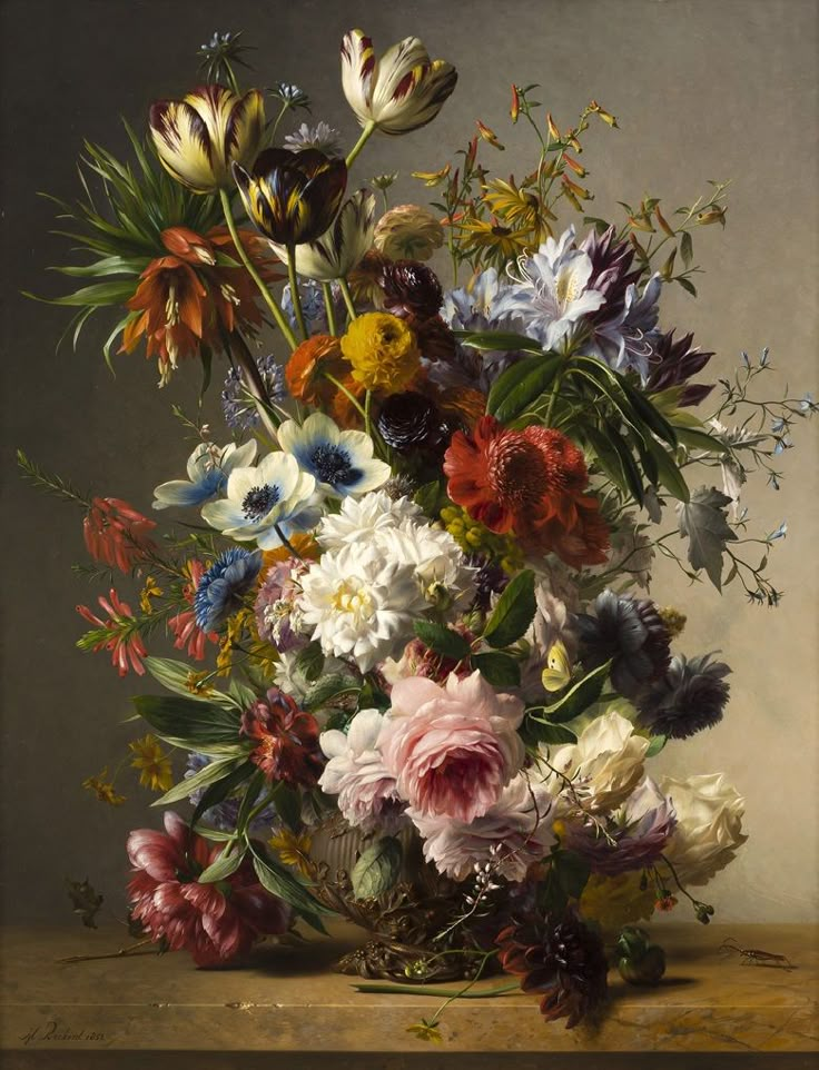 a vase filled with lots of different colored flowers