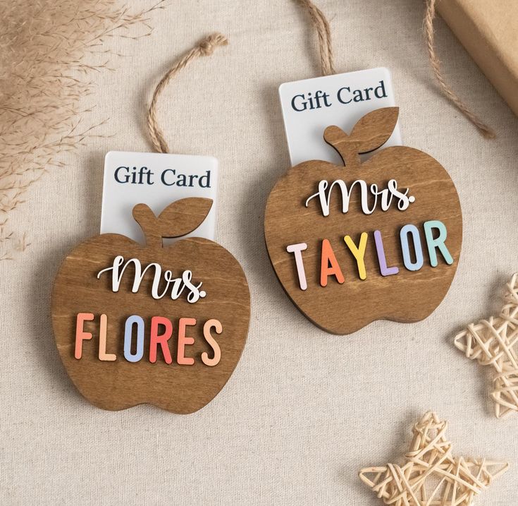 two wooden gift tags with the words mrs and mr's taylor on them