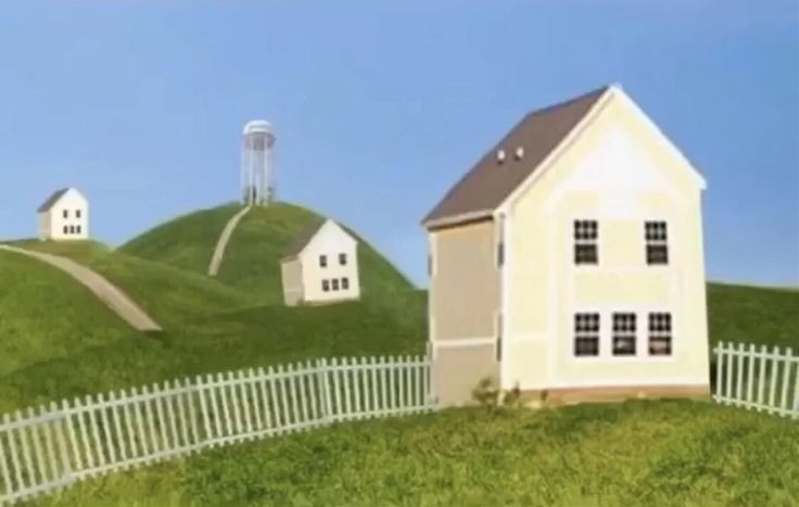 two houses on top of a green hill