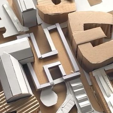 the letters are made out of cardboard boxes