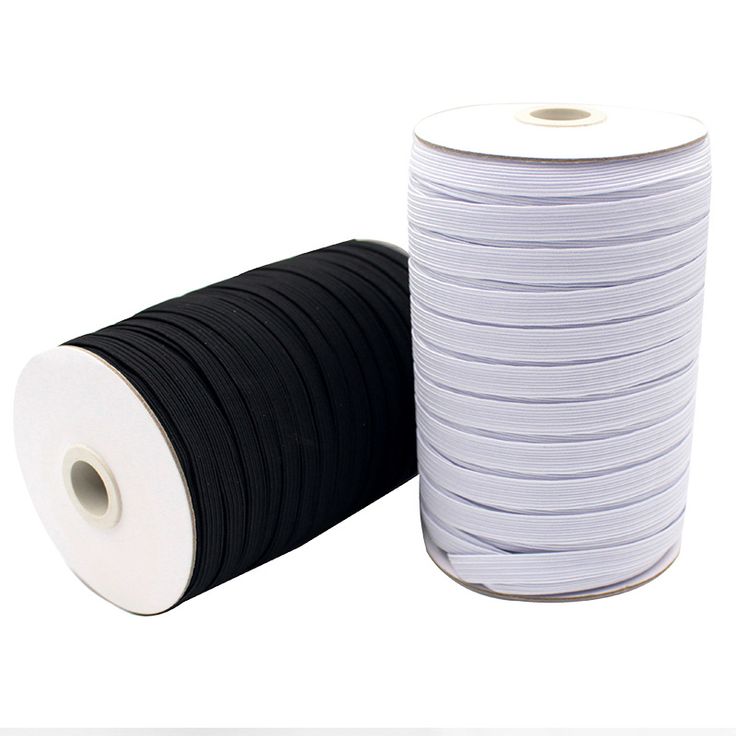 two rolls of black and white paper next to each other