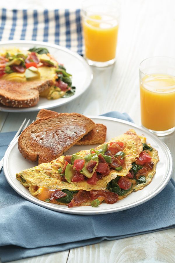 an omelet and toast on a white plate