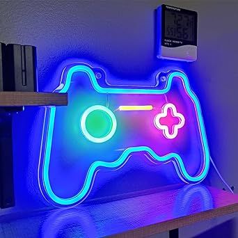 a video game controller neon sign on a shelf