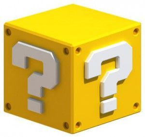 a yellow cube with two white question marks on it