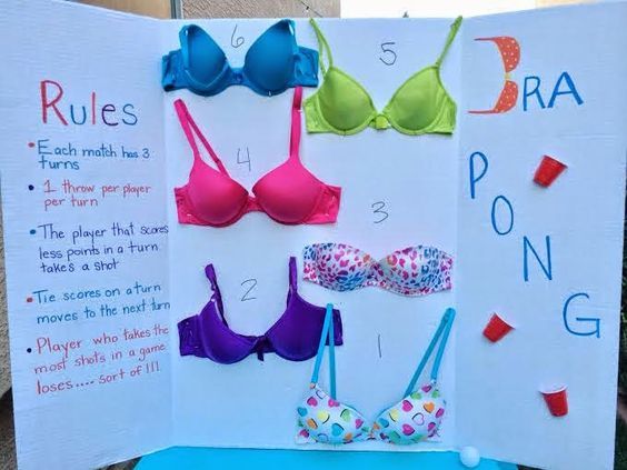 several bras on display in front of a sign that says rules for bra pong