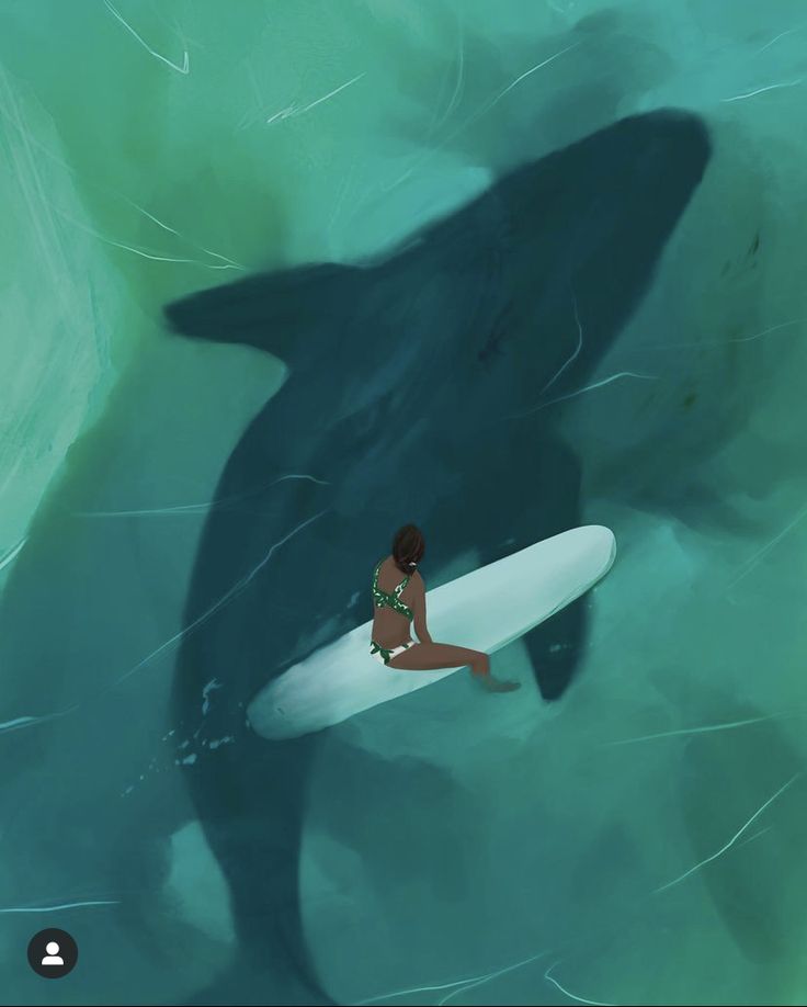 a woman riding on top of a surfboard next to a large whale in the ocean