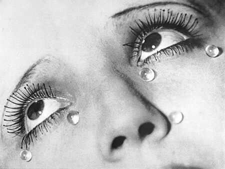 a woman's eye with water drops on it