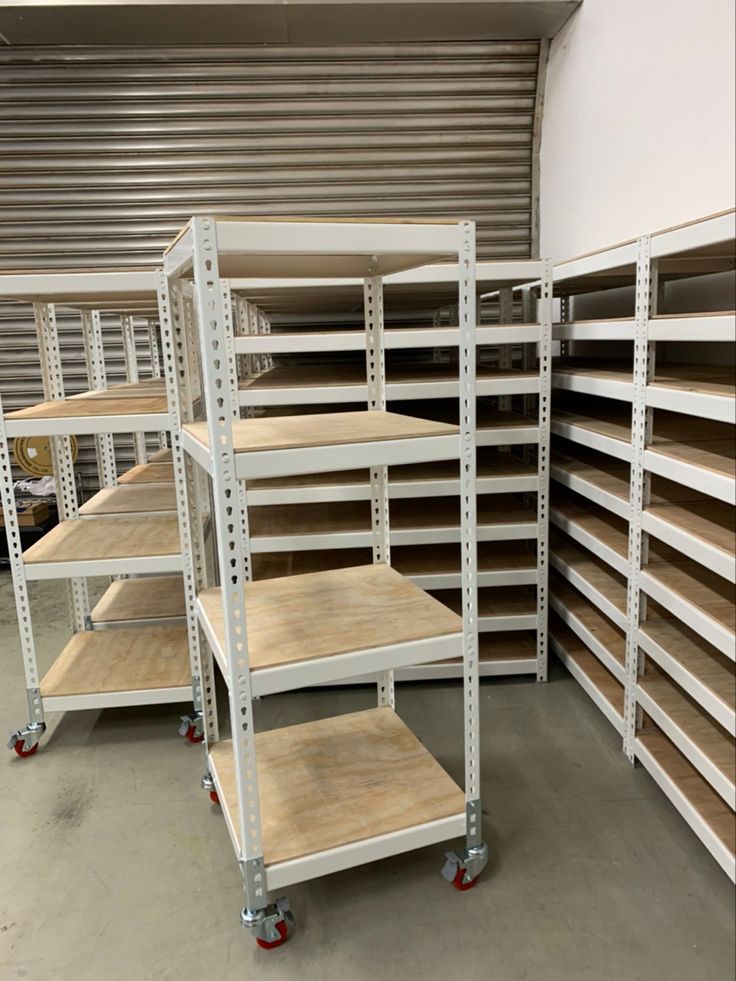 several shelving units in a storage room with no one on the shelf or behind them