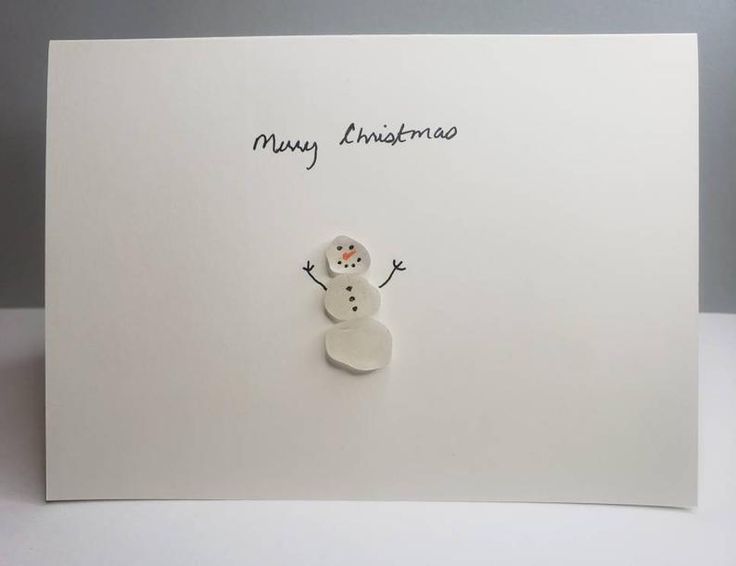 a white card with a snowman on it