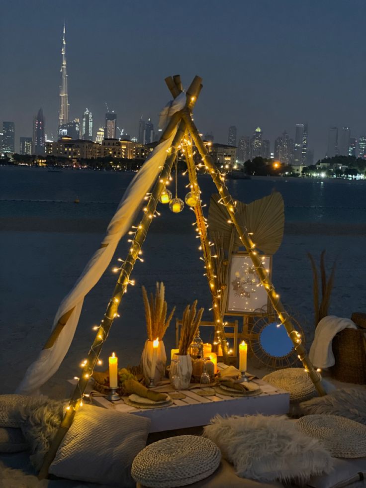 a teepee with candles and lights on it