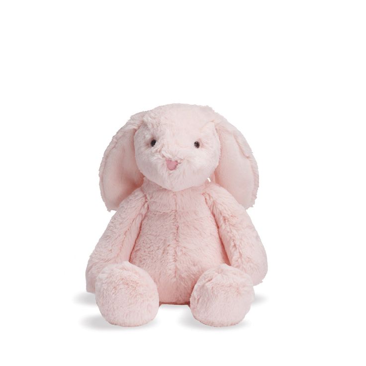 a pink stuffed animal sitting on top of a white surface