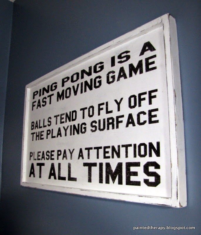 a sign on the wall that says ping pong is a fast moving game balls tend to fly off the playing surface please pay attention at all times