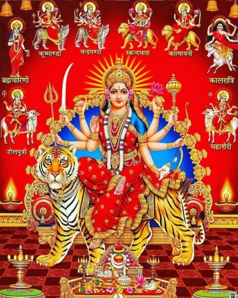 the hindu goddess sitting on top of a tiger