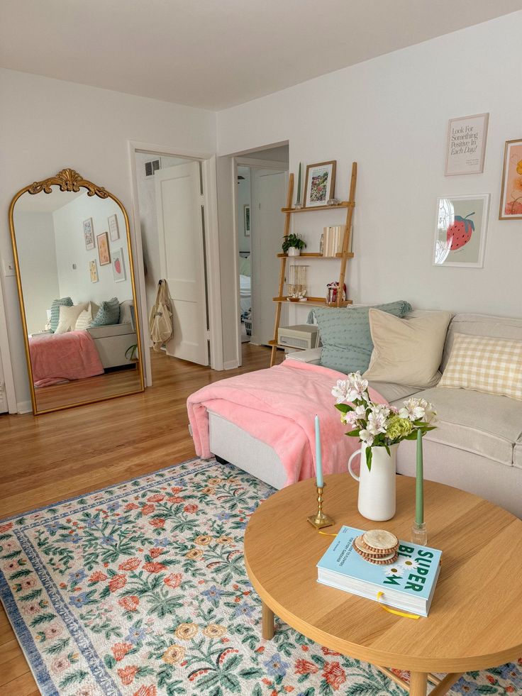 a living room filled with furniture and a mirror